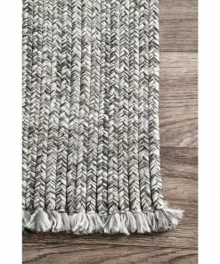 NLD BRAIDED COURT TASSEL PEPPER RUG