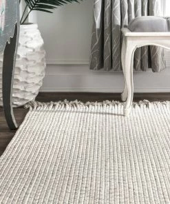 NLD BRAIDED COURT TASSEL PEPPER RUG