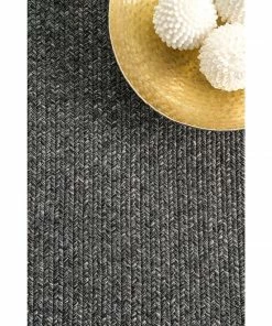 NLD BRAIDED COURT TASSEL PEPPER RUG