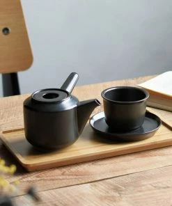 KN BLACK CERAMIC TEA CUP & SAUCER