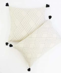 AN WHITE CHEVRON STITCH THROW PILLOW